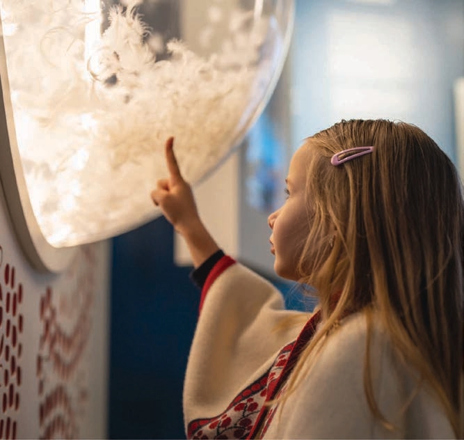 Child interacting with exhibition